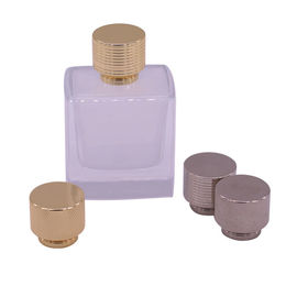 주문 작은 향수병을 위한 아연 합금이 23*27mm 실을 꿴 향수병에 의하여 모자를 씌웁니다 online manufacture